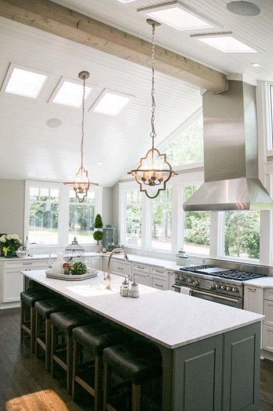 Elegant Pendant Lights Illuminate Spacious Kitchen Island
