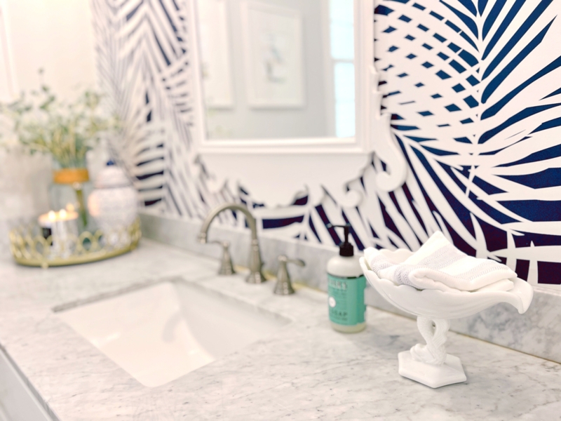 Elegant Powder Room with Hand Towels and Tropical Wallpaper