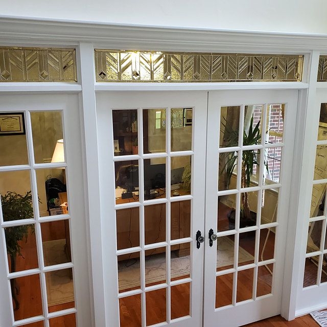 Elegant White French Doors with Decorative Transom