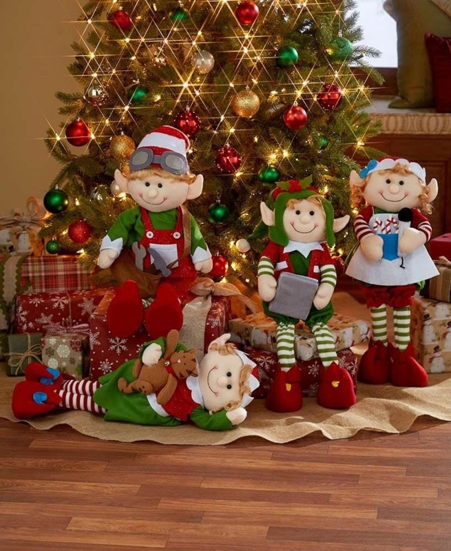 Festive Holiday Elf Decorations by Christmas Tree