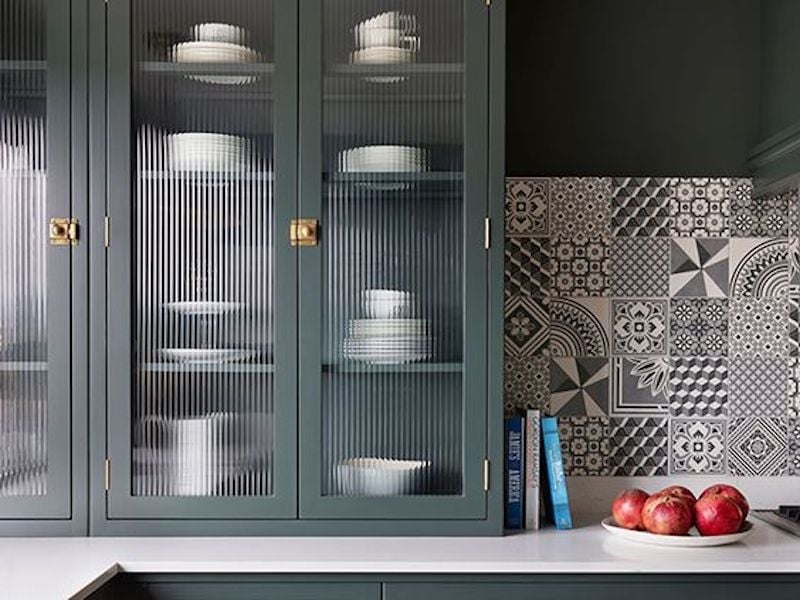 Fluted Glass Cabinets with Patterned Tile Backsplash