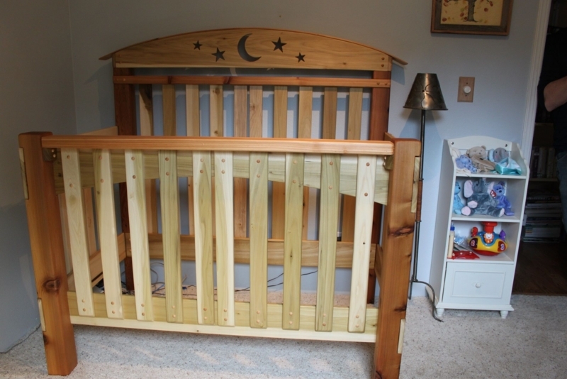 Handcrafted Rustic Wooden Baby Crib with Starry Design