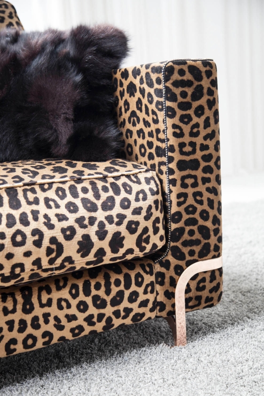 Leopard Print Sofa with Plush Black Pillows