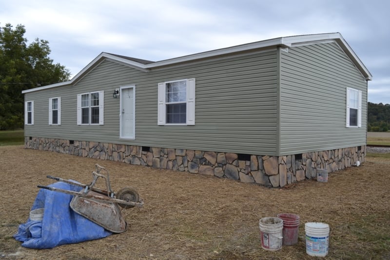 Mobile Home with Stone Underpinning Exterior