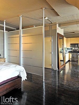 Modern Floor-to-Ceiling Room Divider in Loft Bedroom