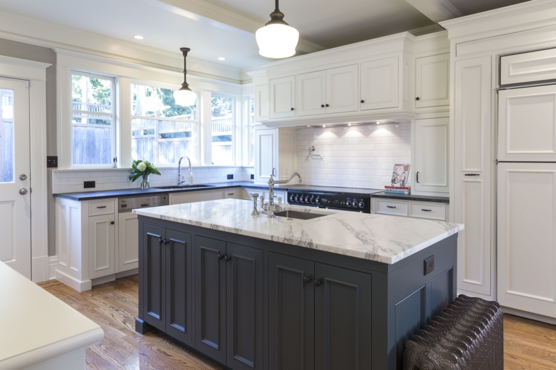 Modern Kitchen with Black Island and Marble Countertop