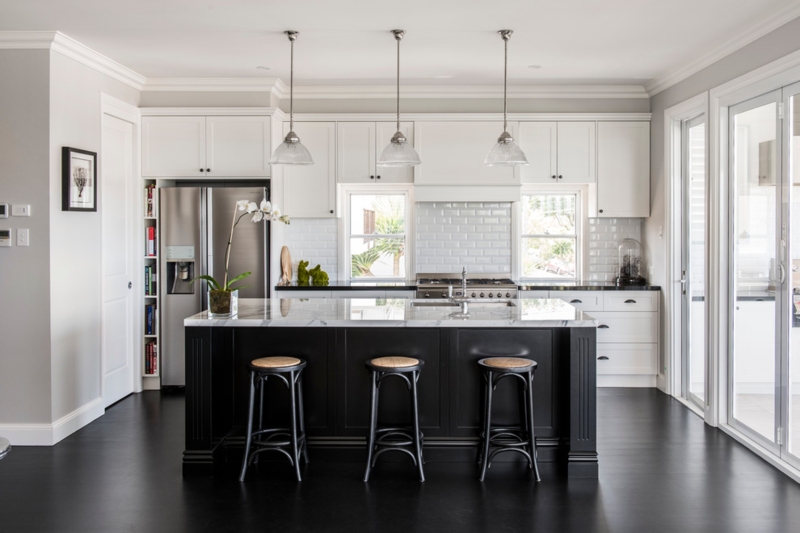 Modern Kitchen with Black Island and White Cabinets