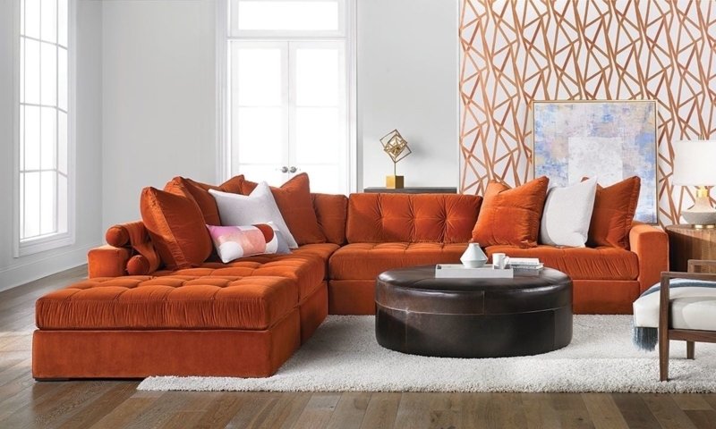 Modern Orange Sectional Sofa with Geometric Accent Wall