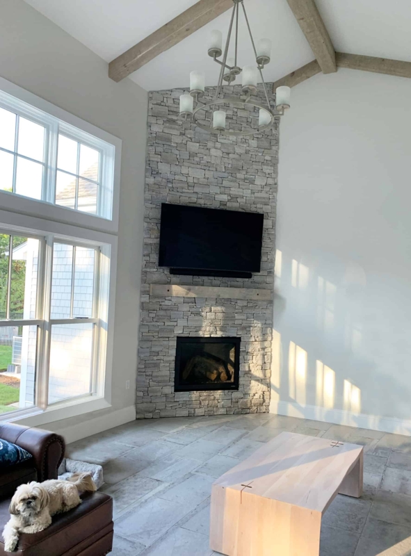 Modern Stone Fireplace with High Ceiling and TV