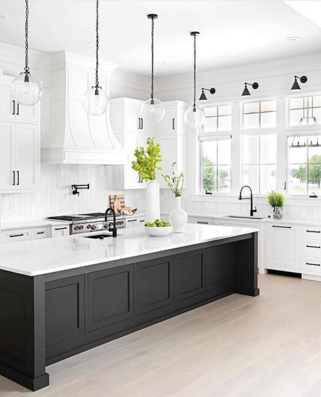 Modern White Kitchen with Black Island and Pendant Lights