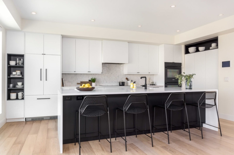 Modern White Kitchen with Sleek Black Island