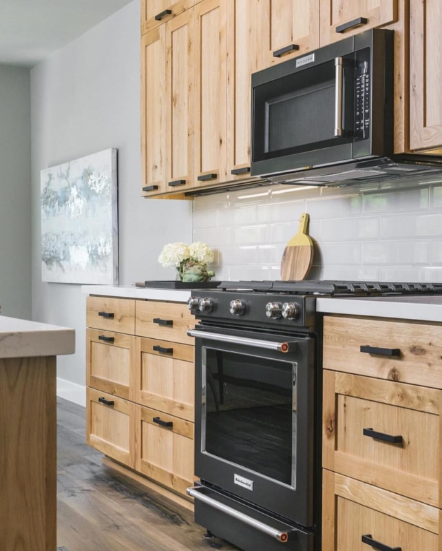Natural Wood Cabinets with Matte Black Kitchen Appliances