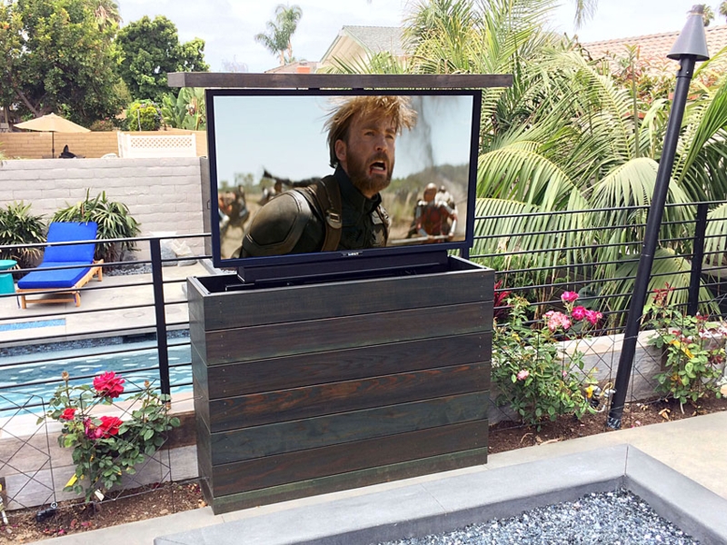 Outdoor Hideaway TV Cabinet by Poolside Seating Area