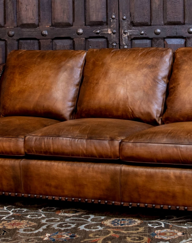 Rich Brown Cowboy Leather Sofa with Vintage Rug