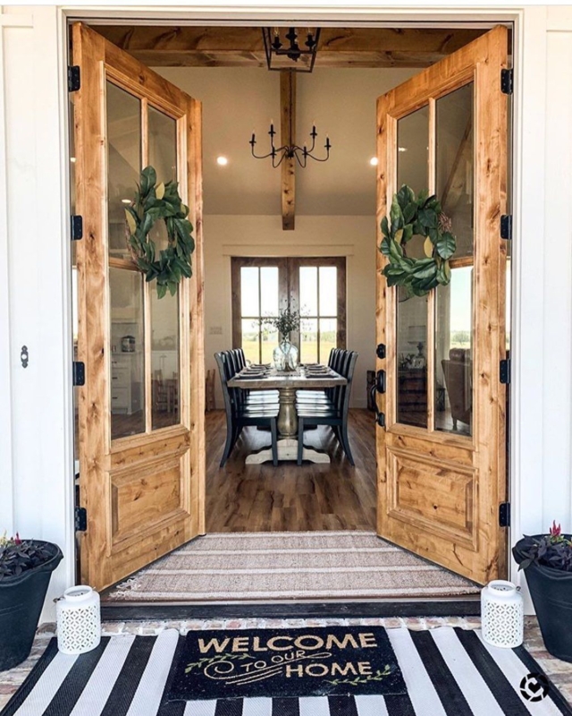 Rustic French Doors Opening to Cozy Farmhouse Dining Room