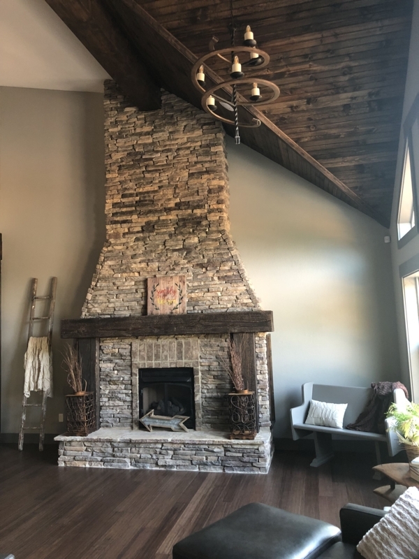 Rustic Tall Stone Fireplace with Wooden Mantle
