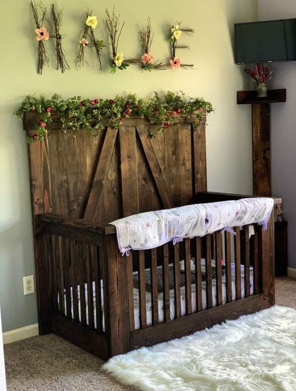 Rustic Wooden Baby Crib with Floral Accents