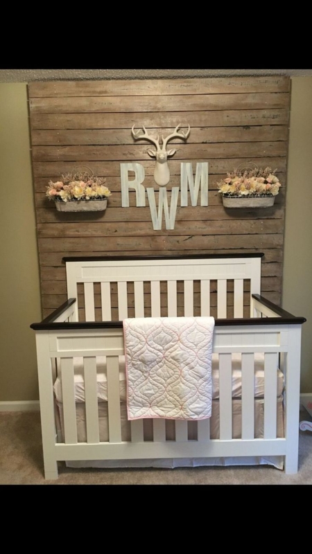 Rustic Wooden Baby Crib with Personalized Decor