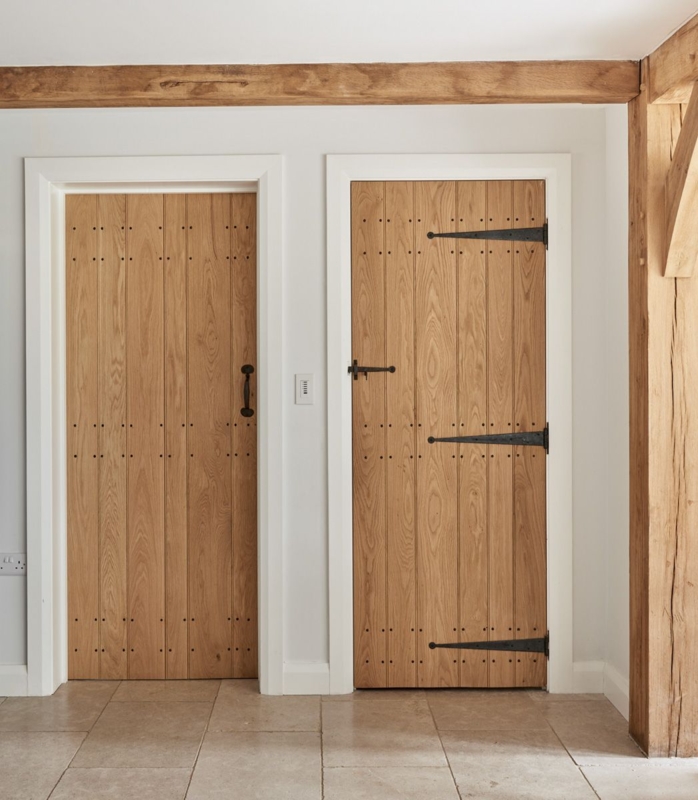 Rustic Wooden Farmhouse Doors with Black Iron Hinges