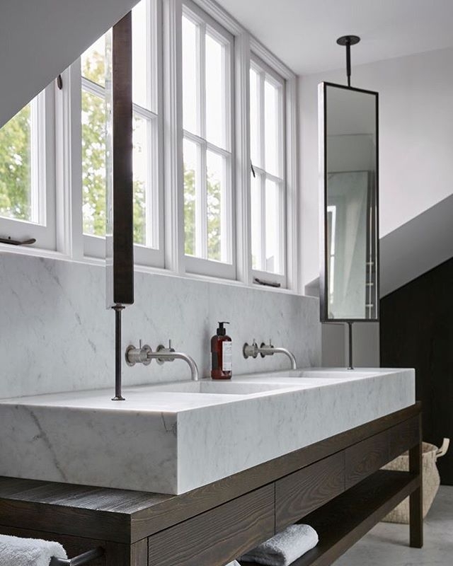 Suspended Bathroom Mirror Above Marble Sink