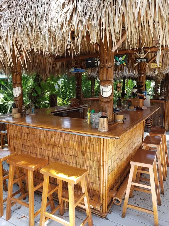 Tropical Tiki Bar with Bamboo Stools and Thatched Roof