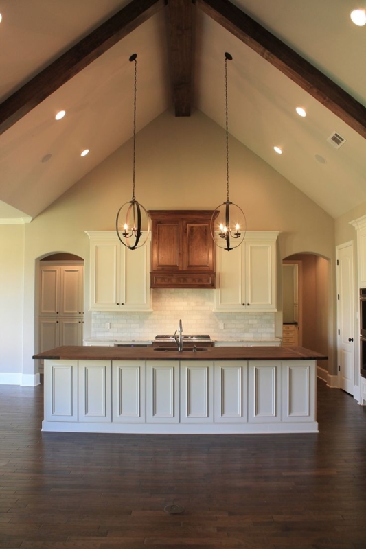 Vaulted Ceiling Kitchen with Track and Pendant Lighting