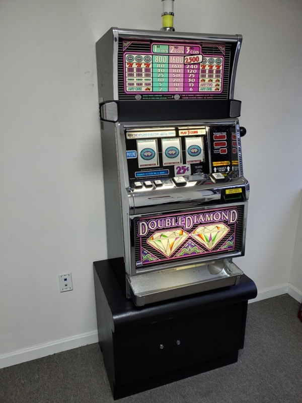 Vintage Double Diamond Slot Machine on Black Stand