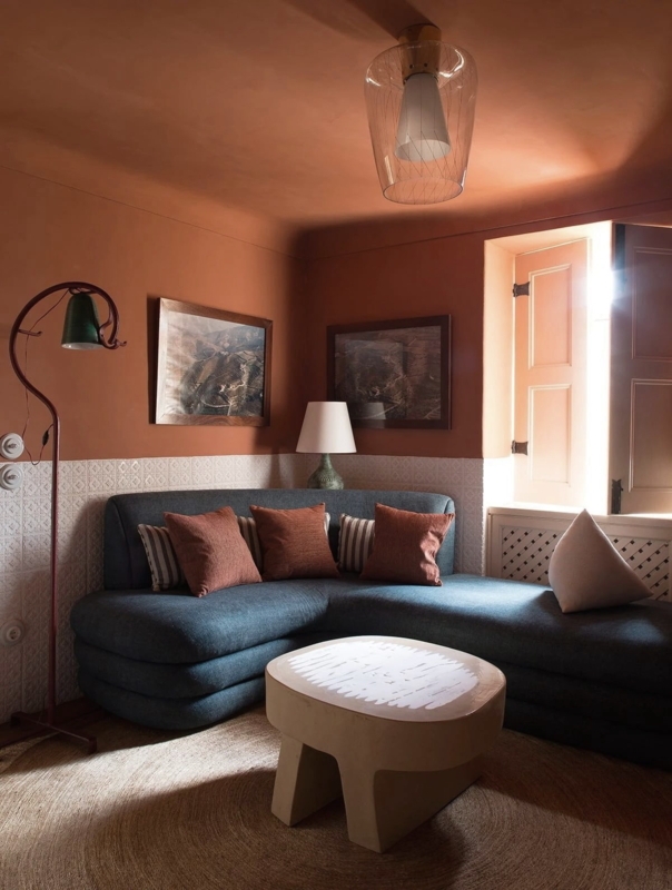 Warm Terracotta Living Room with Blue Sofa