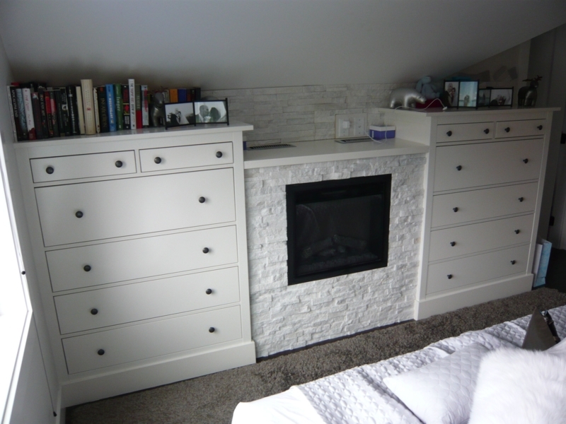 White Dressers with Built-in Fireplace in Bedroom