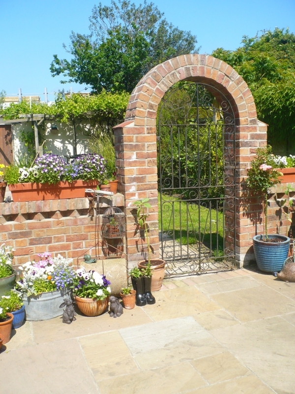 Charming Garden Iron Gate with Brick Archway