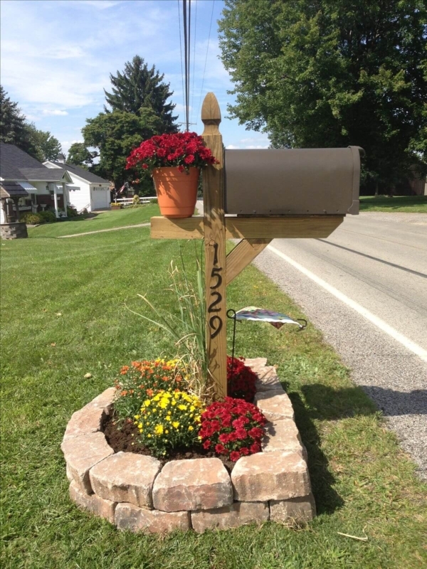 Charming Garden Mailbox with Stone Border and Flowers
