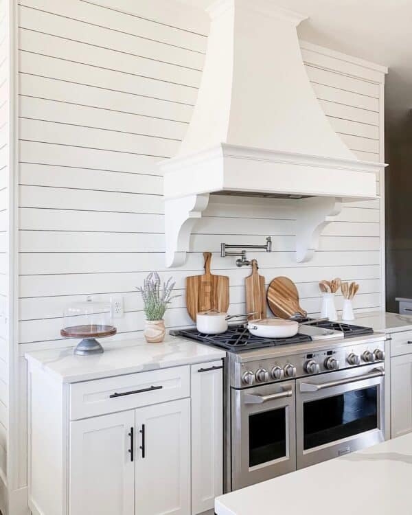 Classic White Farmhouse Range Hood with Shiplap Walls
