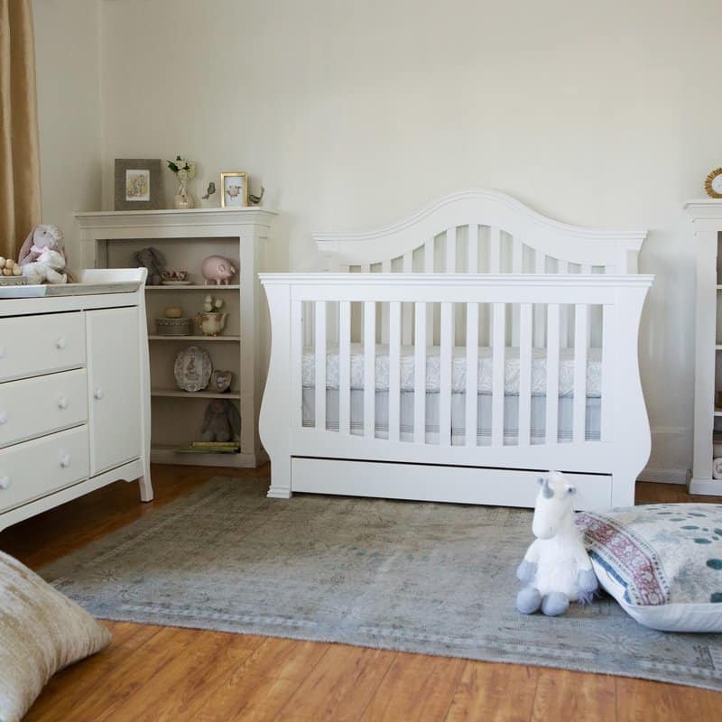 Classic White Wooden Baby Crib in Cozy Nursery