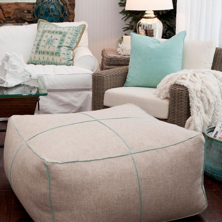 Coastal Living Room with Neutral Ottoman and Soft Pillows