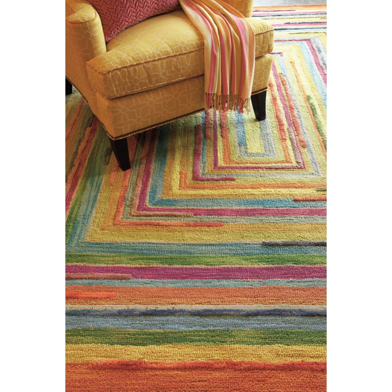 Colorful Concentric Striped Area Rug with Yellow Chair