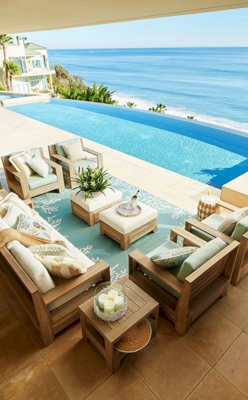 Cozy Coastal Deck Furniture Layout with Ocean View