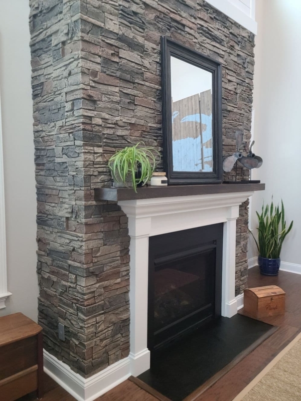 Cozy Fake Stone Over Brick Fireplace Design