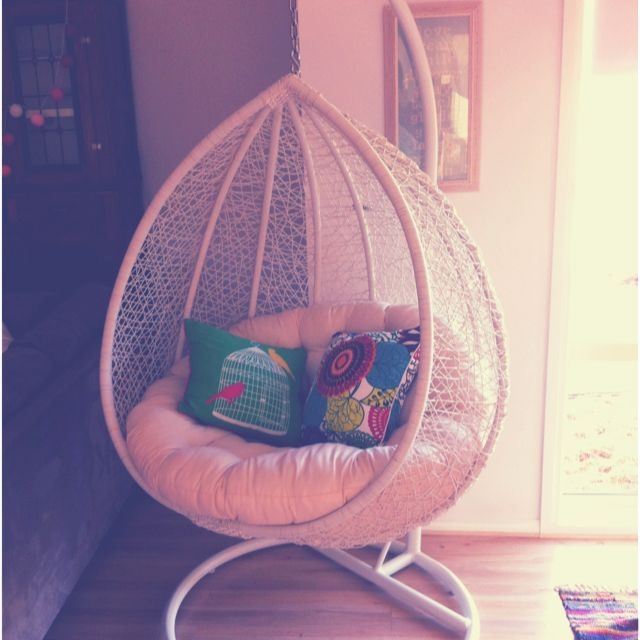 Cozy White Hanging Pod Chair with Colorful Cushions