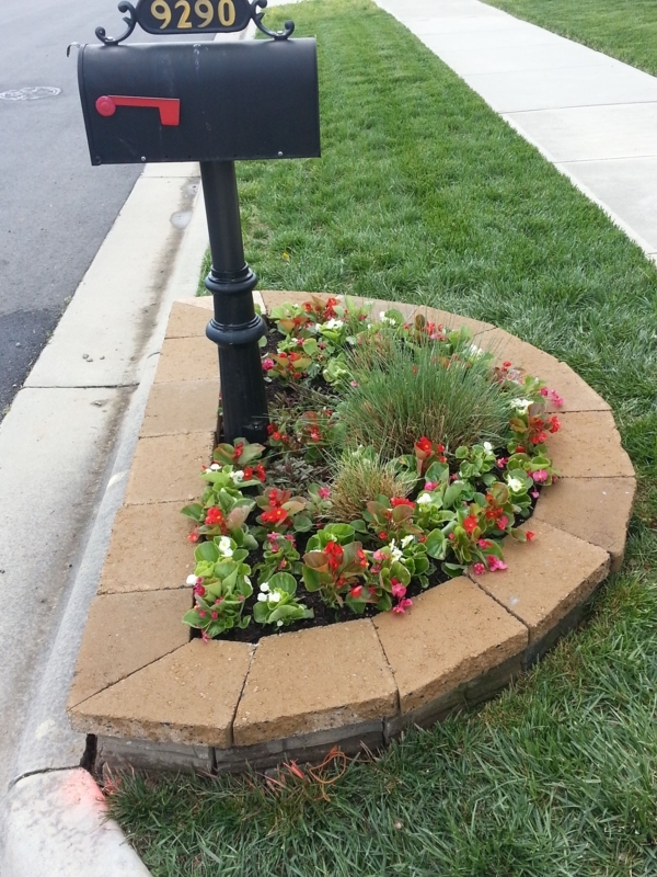 Curved Flower Bed Surrounding Black Mailbox