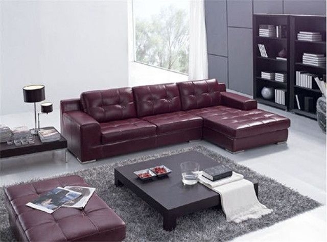 Dark maroon leather L-shape sectional sofa set with black center table ...