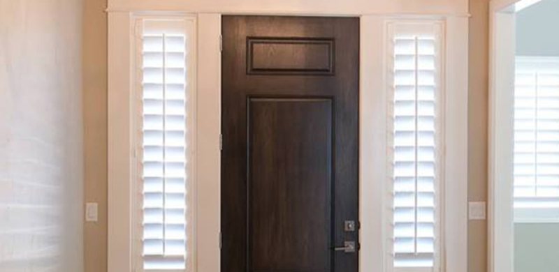 Dark Wood Front Door with White Sidelight Shutters