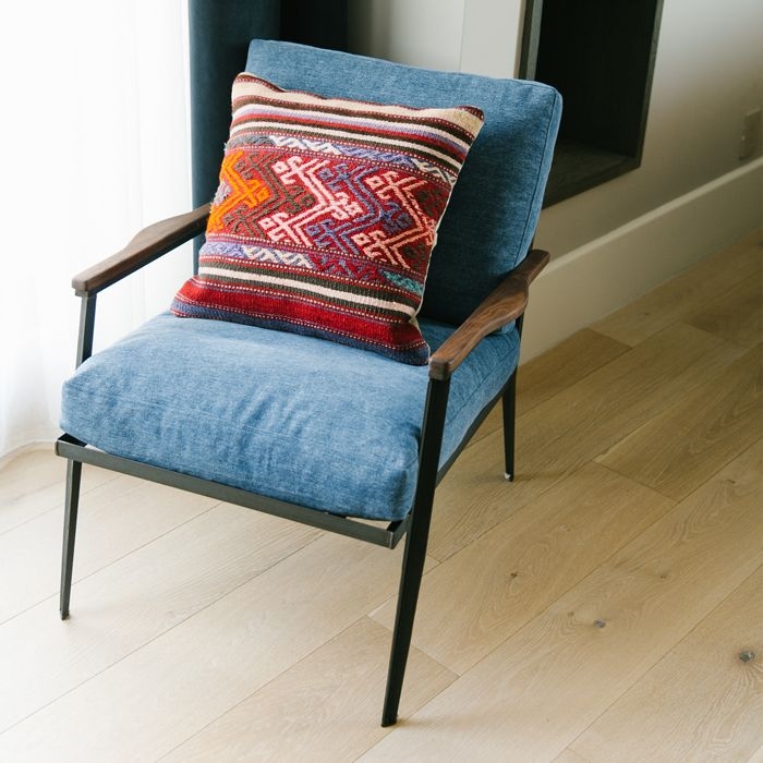 Denim Upholstered Chair with Patterned Accent Pillow