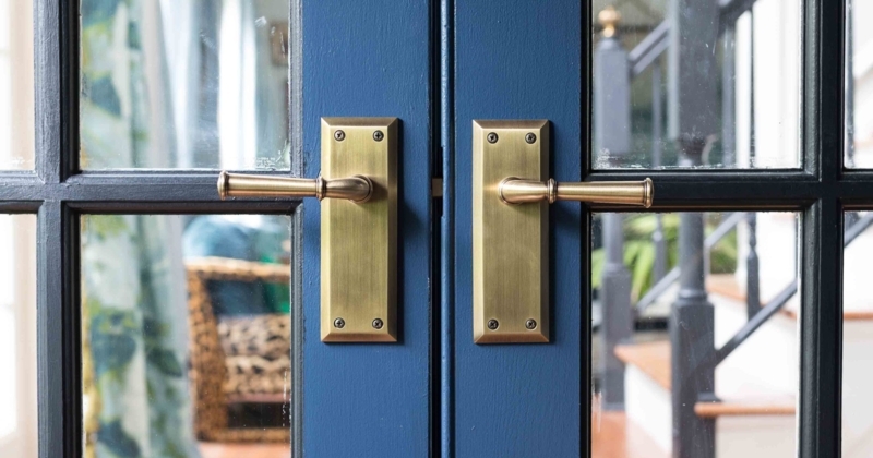 Elegant Brass Door Handles on Blue French Doors