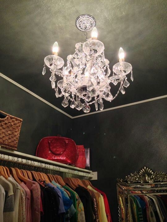 Elegant Crystal Chandelier in Dark Closet Space