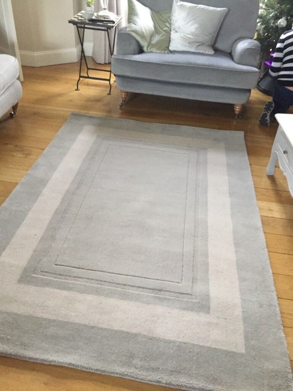 Elegant Grey Wool Rug Enhancing Cozy Living Room