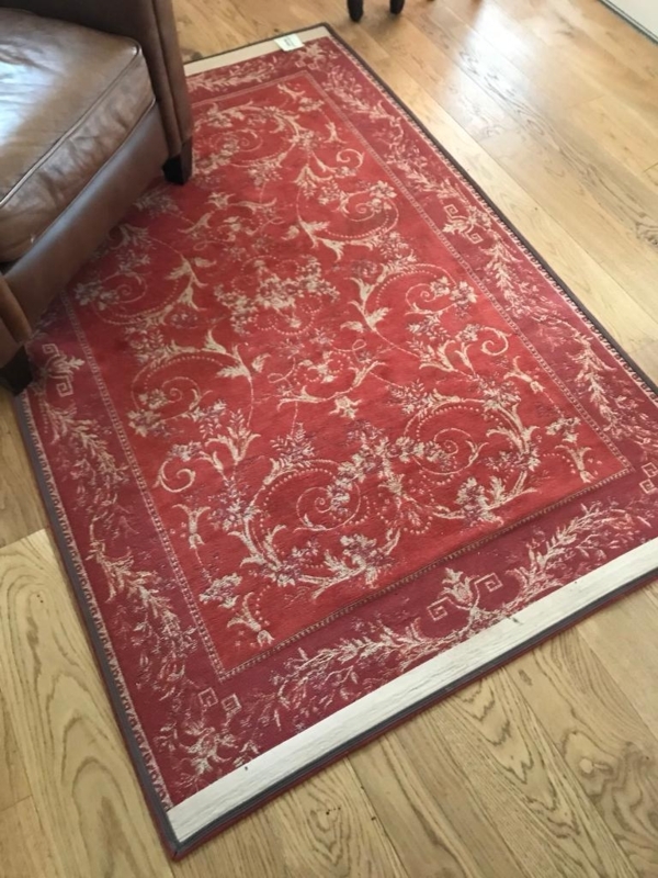 Elegant Red Floral Laura Ashley Rug on Wood Floor