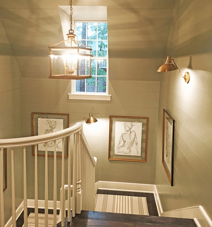 Elegant Staircase with Gallery Wall and Pendant Lighting