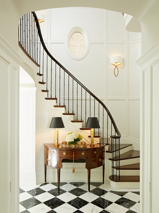 Elegant Stairway with Classic Sconces and Console