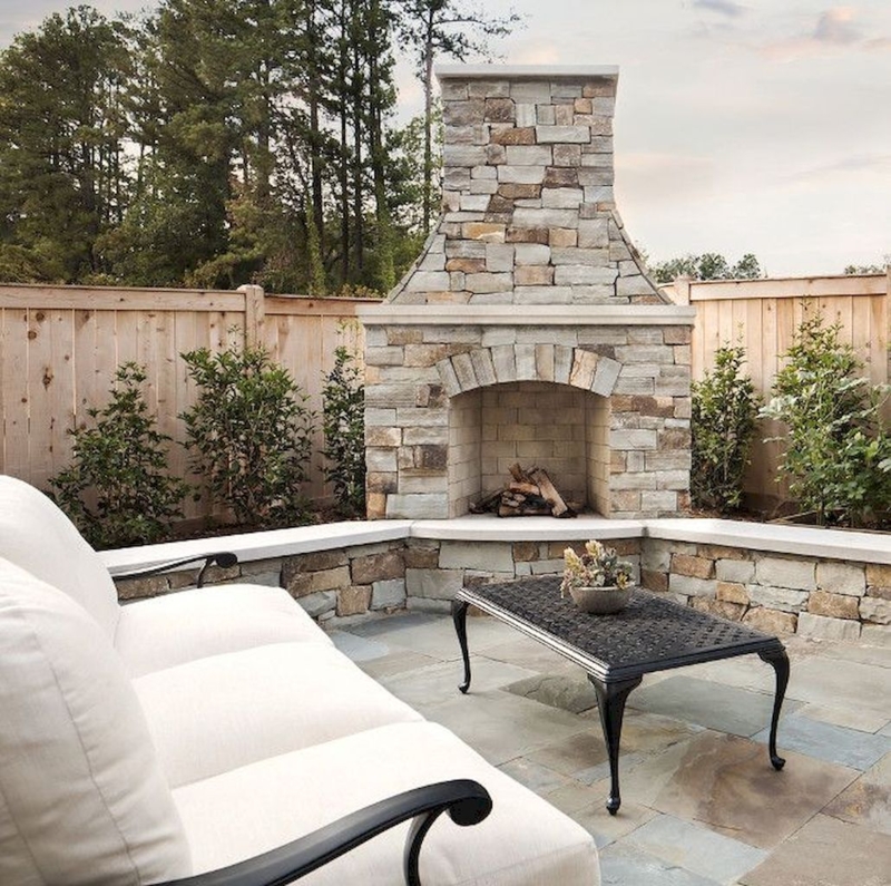 Elegant Stone Outdoor Fireplace with Cozy Seating