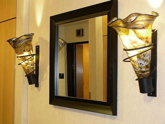 Elegant Wall Sconces Flanking Mirror Design